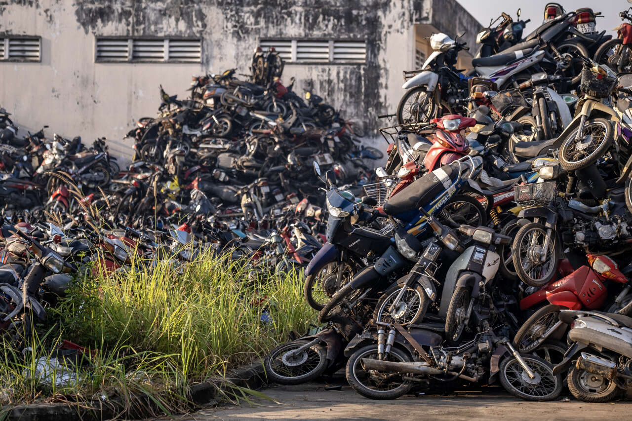 Scooters stacked at police impound lot in Ho Chi Minh City, Vietnam on Jan. 30, 2024. (Linh Pham /The New York Times)